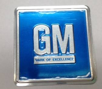 DOOR JAMB DECAL - GM MARK OF EXCELLENCE (STAMPED METAL)