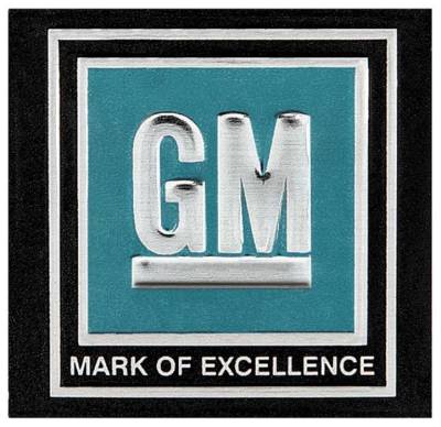 SEAT BELT BUCKLE EMBLEM - GM MARK OF EXCELLENCE - AQUA