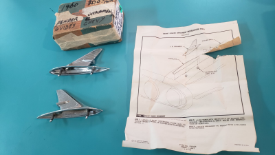 1960 CHEVY PASSENGER FENDER ORNAMENTS - NOS